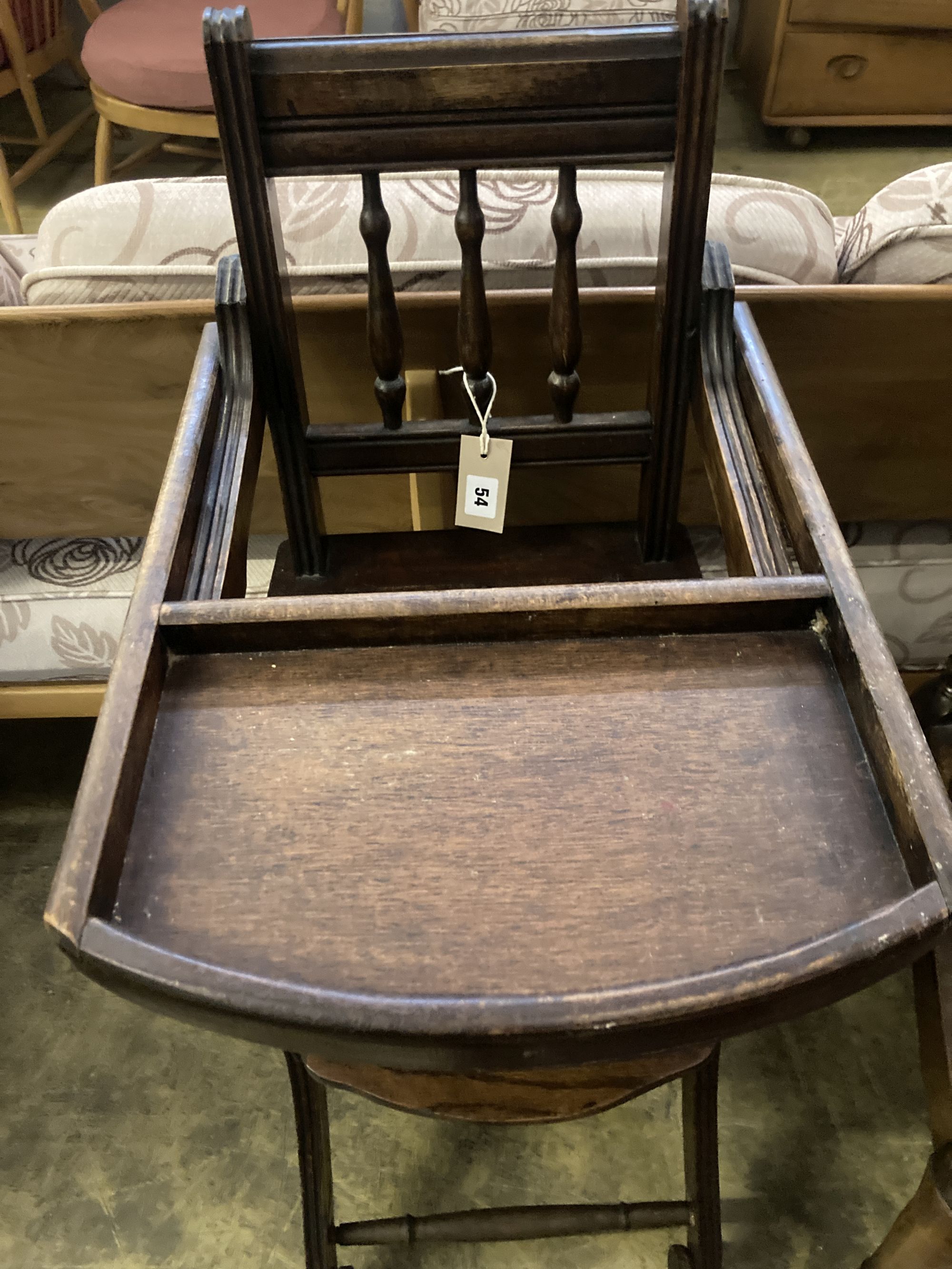 An early 20th century oak and beech childs metamorphic high chair